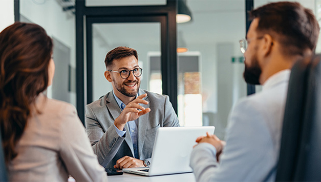 three employees are talking